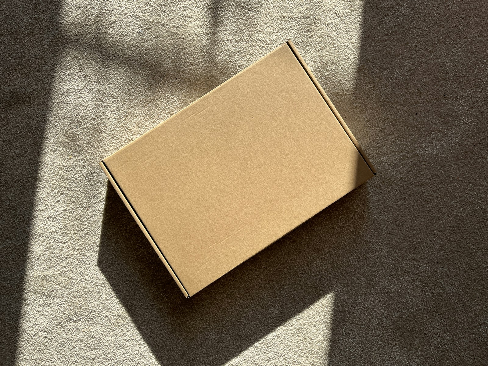 A plain, unmarked parcel in natural daylight.